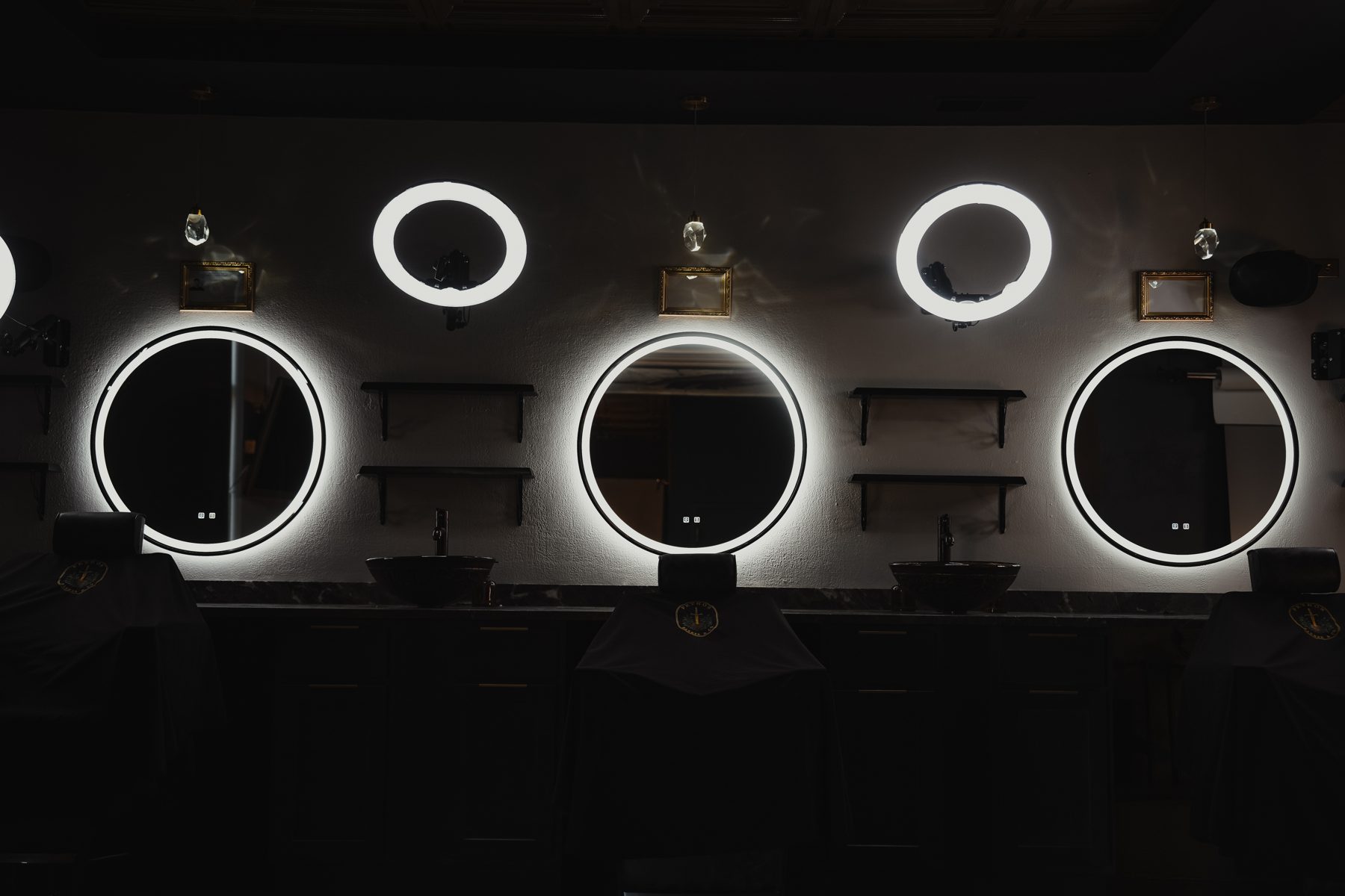 Barber stations and ring mirrors inside Petros